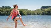 A young woman has fun on the beach